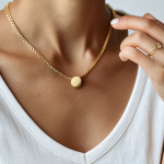 Minimalist Jewelry Styling**

"Close-up shot of a woman's hand wearing several delicate, thin-chain necklaces in silver and gold. She is also wearing simple, minimalist stud earrings. Fully clothed, wearing a modest, casual top. Natural lighting. Safe for work, appropriate content, professional photography, perfect anatomy, well-formed hands, proper finger count, natural body proportions."

**