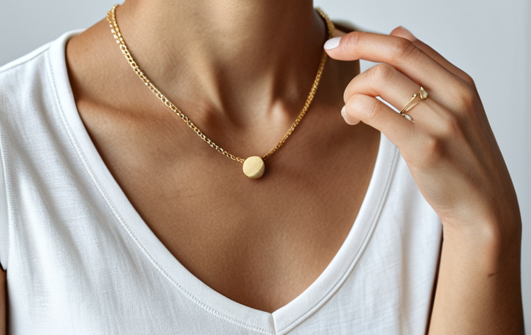 Minimalist Jewelry Styling**

"Close-up shot of a woman's hand wearing several delicate, thin-chain necklaces in silver and gold. She is also wearing simple, minimalist stud earrings. Fully clothed, wearing a modest, casual top. Natural lighting. Safe for work, appropriate content, professional photography, perfect anatomy, well-formed hands, proper finger count, natural body proportions."

**
