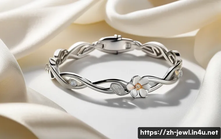 티파니 앤 코 팔찌 컬렉션 비교 - A close-up shot of an elegant Tiffany silver bracelet resting gracefully on a smooth, light-colored ...